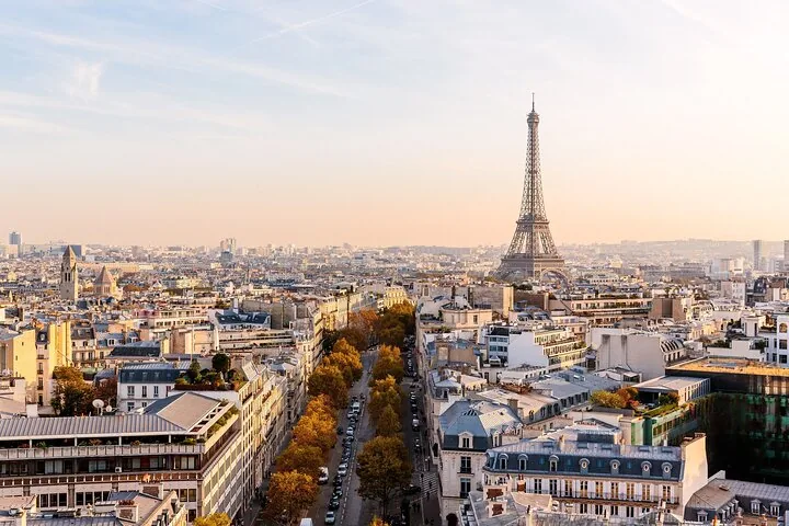 Paris rooftops with the Eiffel Tower on the horizon